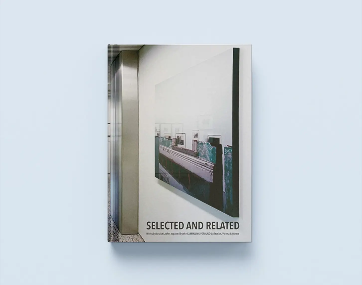 The exhibition catalog Selected and Related shows a photo from the Vertical Gallery. A work of art from the exhibition hung on a white wall. The photo was taken from the side.