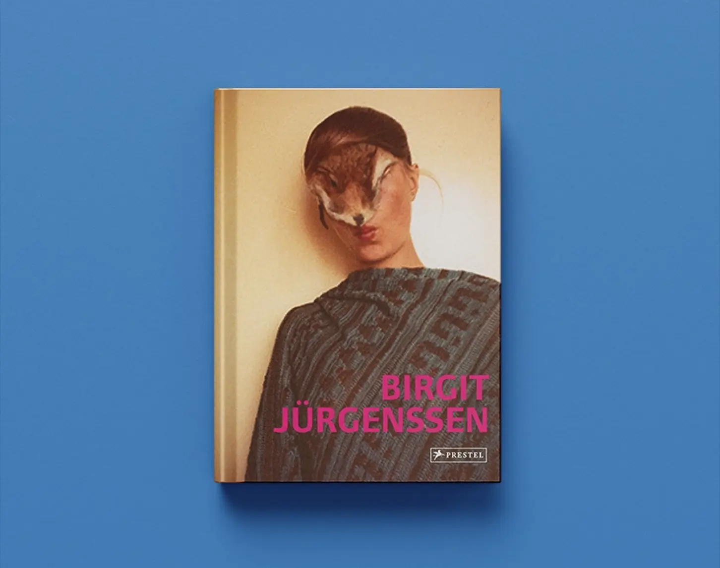 The exhibition catalog by Birgit Jürgenssen from 2012 shows a color photograph of a woman. What is striking is her hair, which seems to turn into a kind of fur. Her eyes and nose are covered.